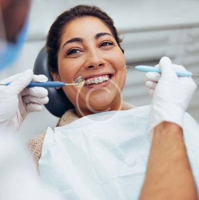 "Dentist performing root canal procedure"