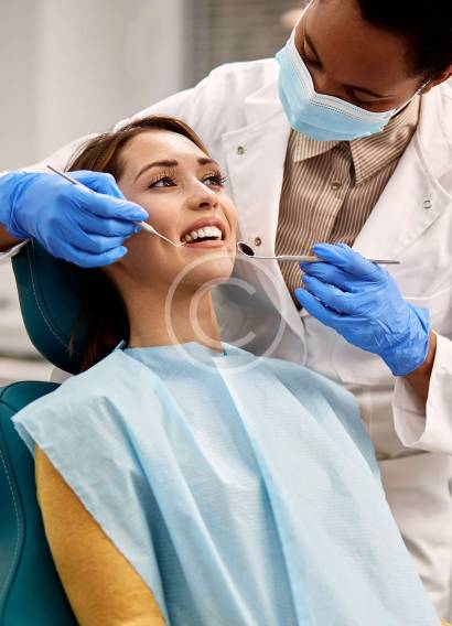 "Pediatric dentist with young patient"